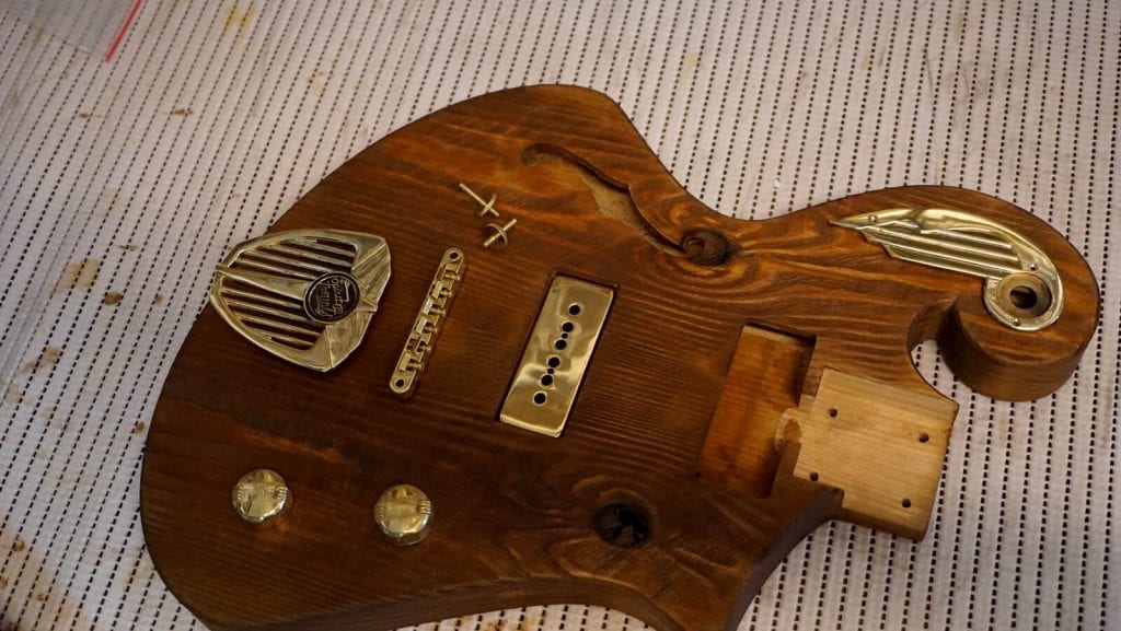 handmade guitar with custom brass hardware